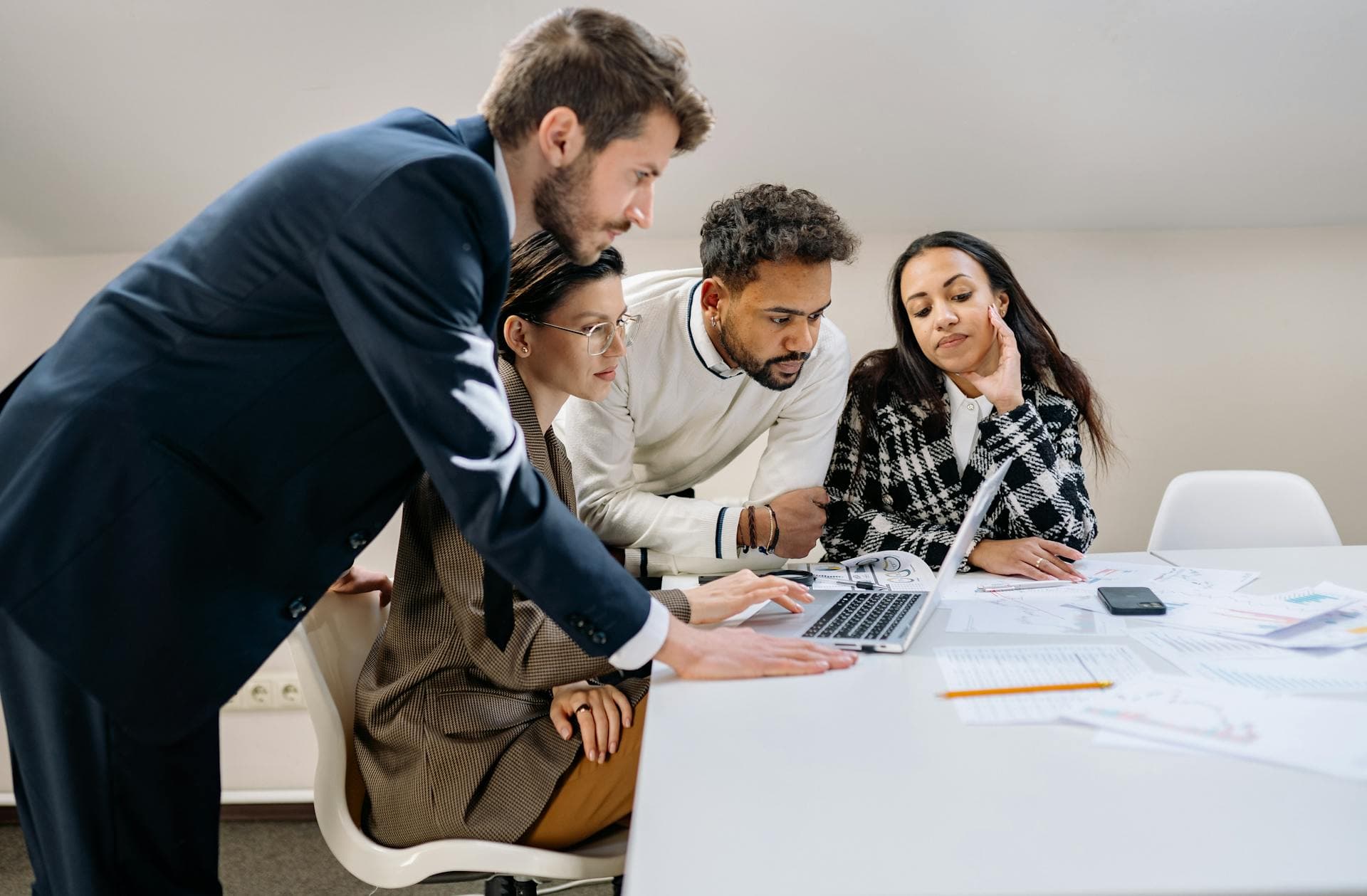 Diverse team of tax and accounting professionals collaborating around a conference table